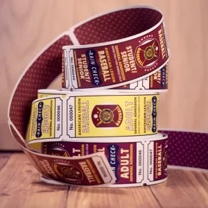 3 rolls of 2x6 2-part tickets to a baseball game. Each roll is a different color and features a star-pattern back side.