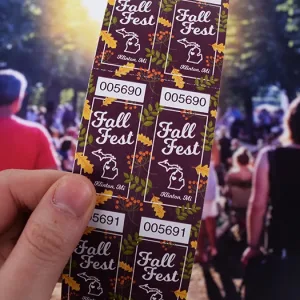 2x2 coupon-style roll tickets for a Michigan fall fest with a leaf pattern background