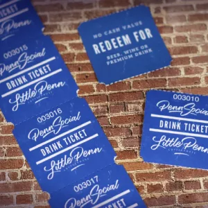 A strip of 2x2 rounded corner drink tickets in a deep vibrant blue
