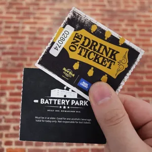 2x2 drink ticket tickets for a music festival. The backside has disclaimer text