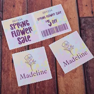 Barcoded 2x4 marquee-style coupon roll tickets for a spring flower sale. Both the front and back sides features a soft pastel background